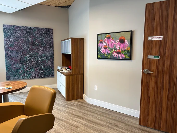 Artworks for Cancer artworks installed in the Executive Director's office at Hospice Vaughan: Margaret Scobie, Bush Medicine Leaves, 2012 , Acrylic on Canvas  & Gerry Sevier, Pink ConeFlowers, Oil on canvas 