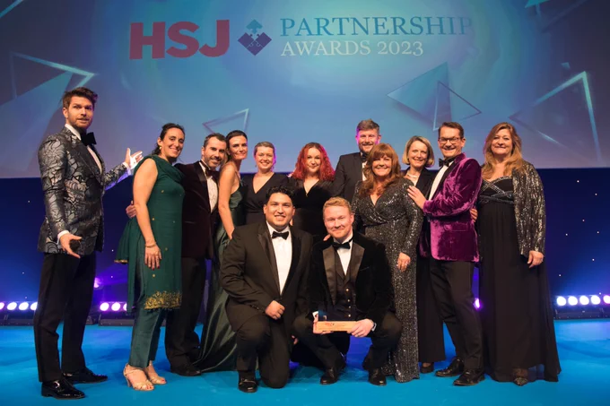 The team pose together at the award ceremony