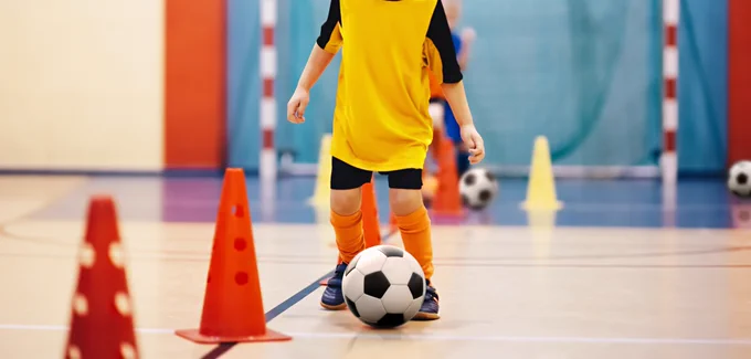 Child taking part in HAF activity session