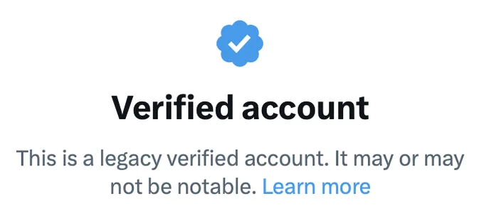 A screenshot of what appears when a Twitter user clicks on a blue checkmark for previously verified accounts who are not part of Twitter Blue. It says "verified account" and that "this is a legacy verified account. It may or may not be notable." A learn more hyperlink goes to a Twitter help page. 