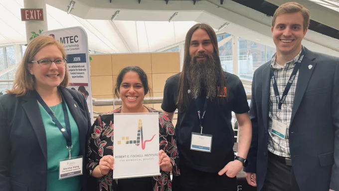 Photo of Fischell Institute foundry members: Martha Wang, Ambi Narula, Ryan Smith and Quinn Burke at the MedTech Conference in Baltimore, Maryland.  