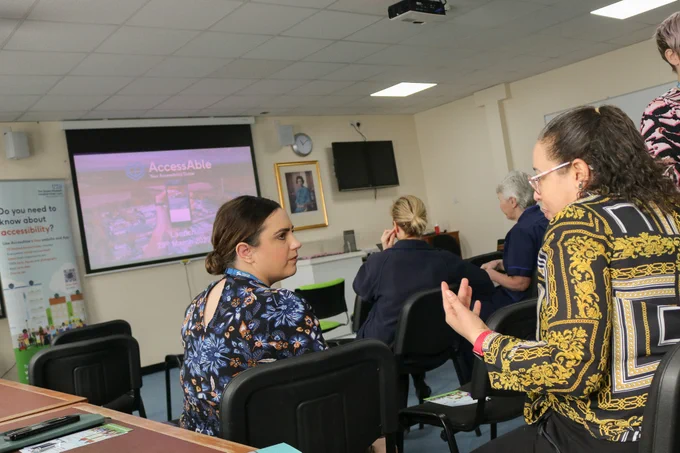 Photo of TeamQEH members in discussion during the AccessAble launch event