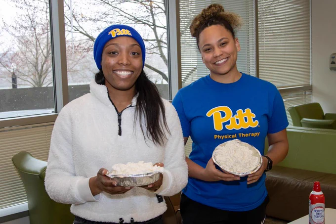 LaPrade and Marshall with their well-tended whipped cream pies