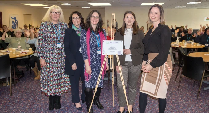 AccessAble launch event, photo of Cara Donnelli-Hunn, Amanda Oates, Alison Paul, Ellen Ilot, Anna Nelson and everyone hand waving the dead clapping way.