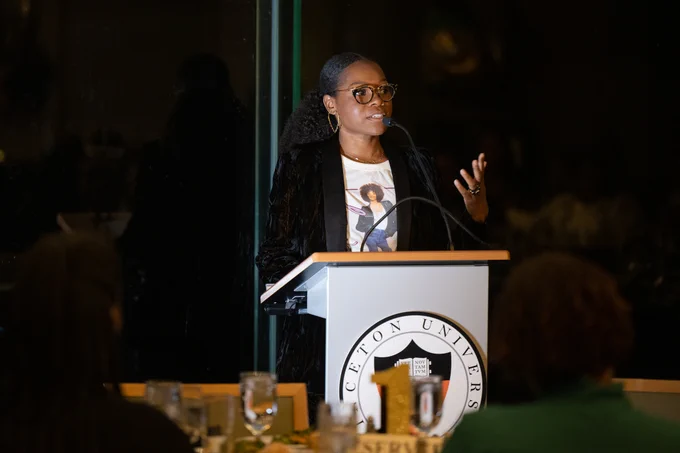 Myleik Teele speaks during Princeton's Black Women's Wellness dinner