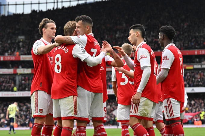 The Arsenal players celebrate with Granit Xhaka after his goal.