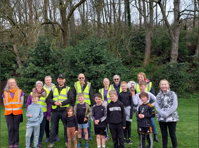 Group photo of volunteers and finishers at Wilton Park junior parkrun