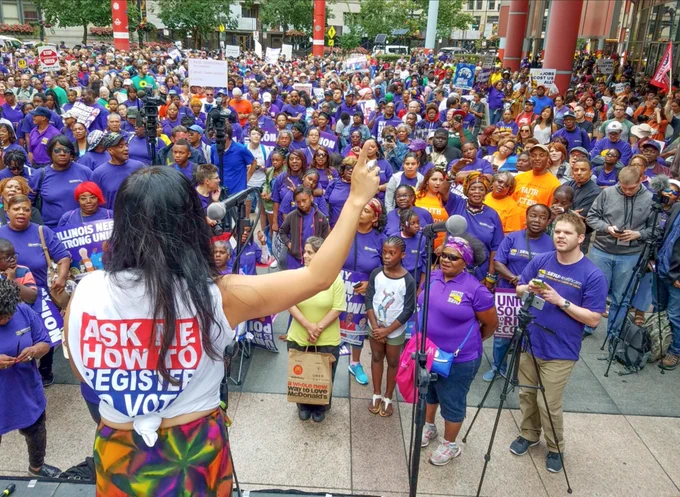 Leni speaking to a crowd of union members