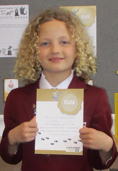 child holding certificate
