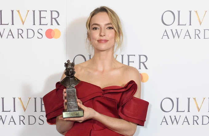 Jodie Comer holds her Olivier award, which she won for her performance in Prima Facie