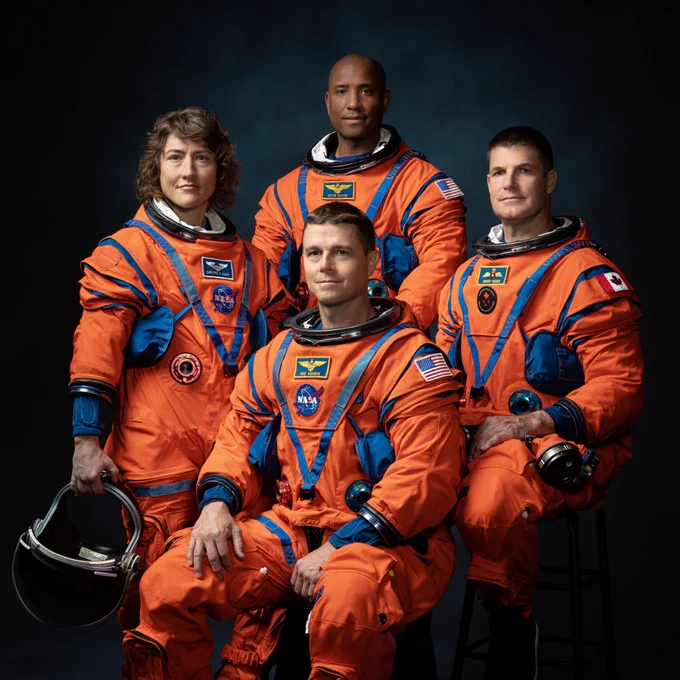 The Artemis II Crew Astronauts pose for a photo in their orange spacesuits. Pictured: Commander Reid Wiseman, Pilot Victor Glover, Mission Specialist 1 Christina Koch, Mission Specialist 2 Jeremy Hansen. Credits: NASA/Josh Valcarcel
