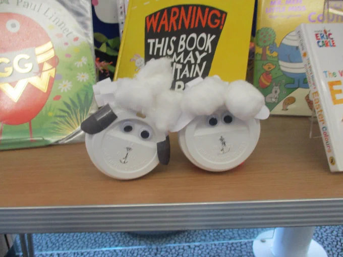 spring lambs made from coffee cup lids and cotton wool