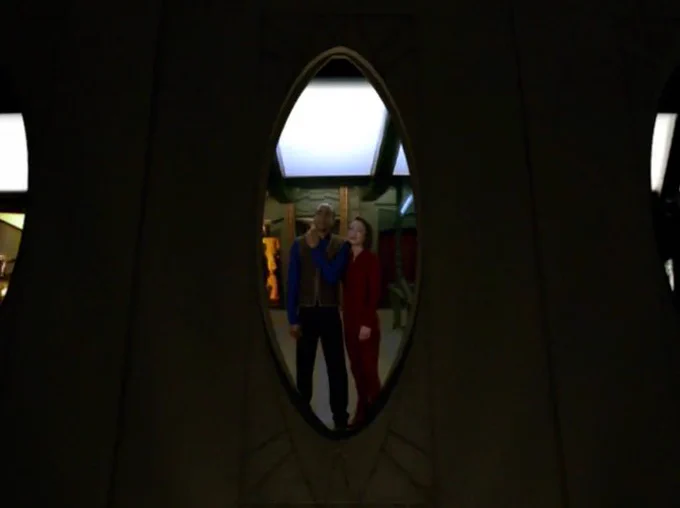 Jake and Kira staring out the window toward the Bajoran wormhole.