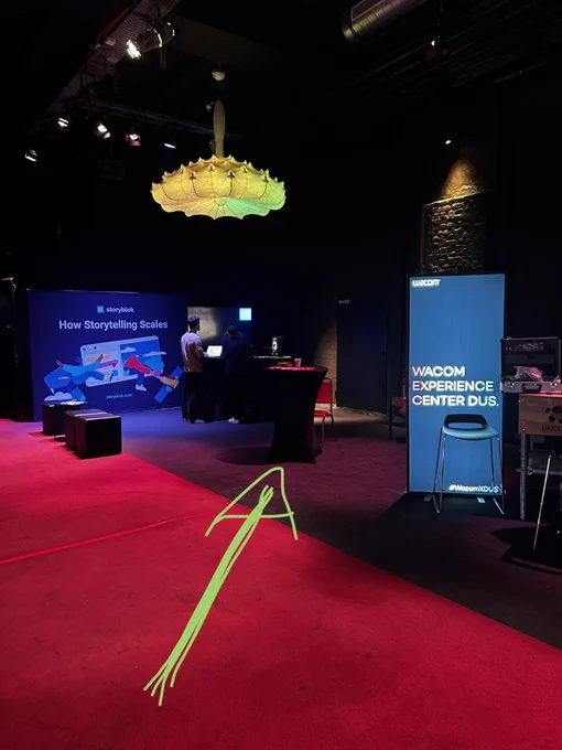 Conference Buddy table between the booths of Wacom and Storyblok
