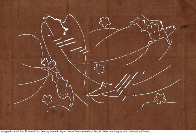 White line drawing of bats flying on a brown background