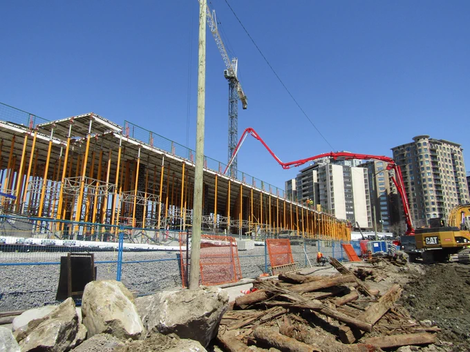 Concrete pump pouring a slab for the second level of the Ādisōke facility