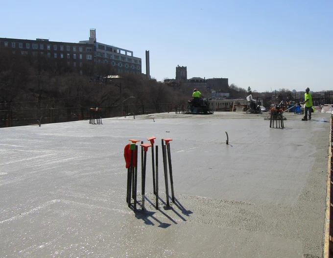 Freshly poured concrete slab at the Ādisōke project site 