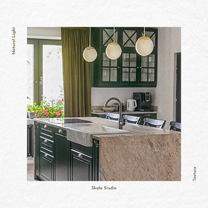 Kitchen Design. Deep bottle green kitchen cabinets. Marble island with the brushed gold panel facing the bar area with black barn style stools. 