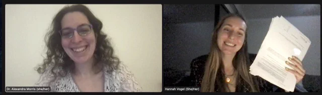 A photo of Alexandra and Hannah taken via Zoom. We are both smiling at the camera. Hannah holds the book contract in her hand. It is day in the image of Alexandra and night in the image of Hannah. Alexandra is wearing a white lace shirt and Hannah is wearing a black shirt with a gold necklace. 