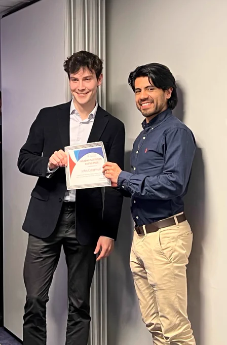 Gabriel Perez from ISIS Neutron and Muon Source presenting John with his certificate.