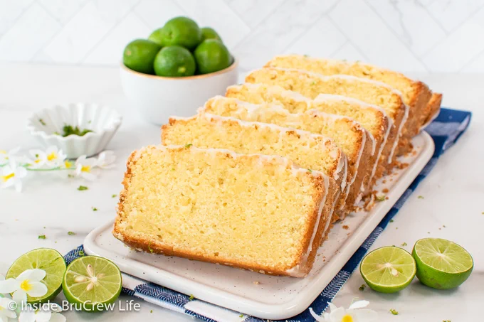 Slices of key lime pound cake on a white plate.