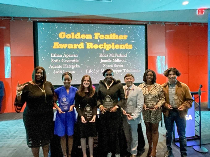 A group capture of the recipients of the Golden Feather Award.