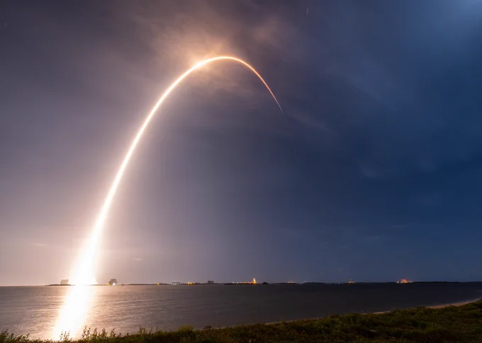 A light streak appears behind the Intelsat 40e rocket launch.