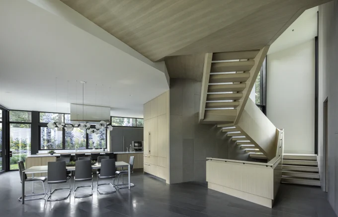 light wood twisting modern staircase