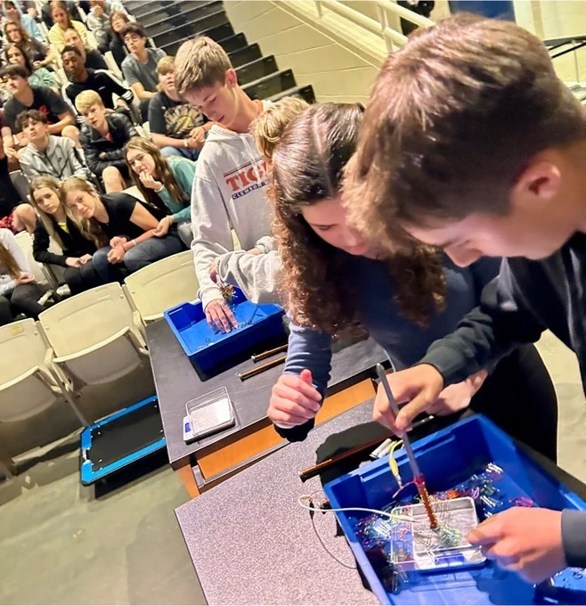 students doing science experiment 