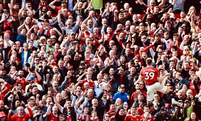 Scott McTominay celebrates his goal v Everton in front of the Stretford End.