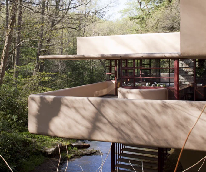 A few of Fallingwater's living room and eastern terrace as viewed from the bridge.