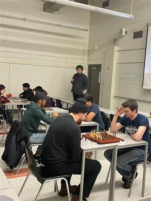 Students playing chess.