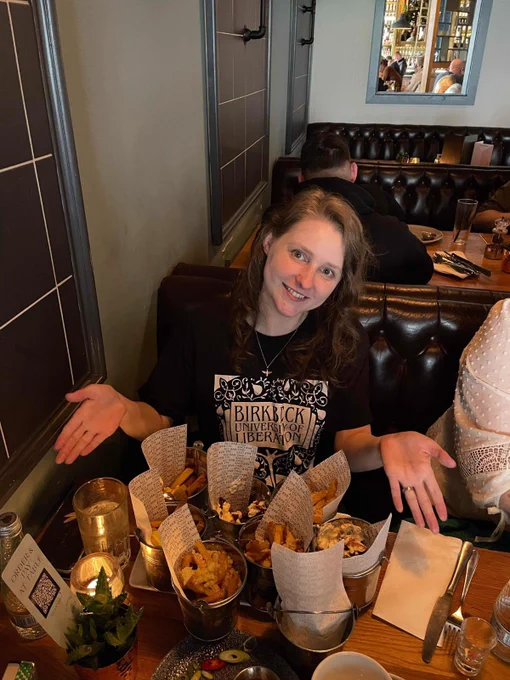 Person wearing Birkbeck University of Liberation t-shirt while having dinner. 