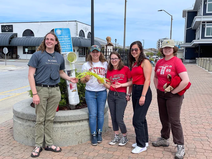 NC State University Semester at CMAST students (left to right) Adam Wampler, Sarah Smith, Catherine Kirch, Zofia Cavalli, and Abby Lee helped Dr. Vicky Thayer, NC State University Coordinator of Semester at CMAST and North Carolina Division of Marine Fisheries (NCDMF) Marine Mammal Stranding Network Coordinator, collect discarded used monofilament fishing line for recycling on the Morehead City waterfront in April.  Thayer collaborates with Keith Rittmaster at the North Carolina Maritime Museum, who directs the monofilament recycling program.