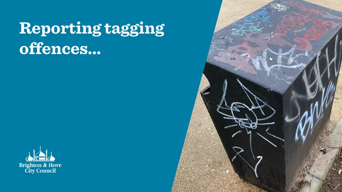 The image shows a black street litter bin with red, white and silver graffiti tags. The text reads "Reporting tagging offences...".