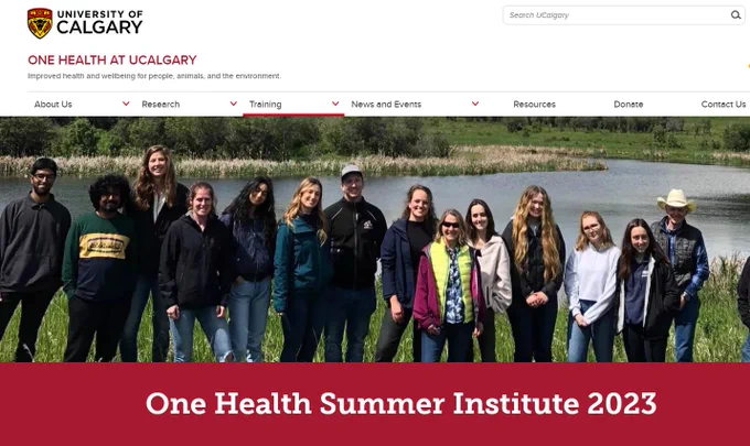 A screenshot of a webpage on the One Health at the University of Calgary website that features the One Health Summer Institute 2023. A photograph of the participants at the 2022 One Health Summer Institute is included. The group of 14 people are standing in front of a river.