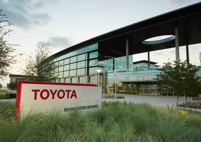 The front view of a building with Toyota written on the entrance sign.
