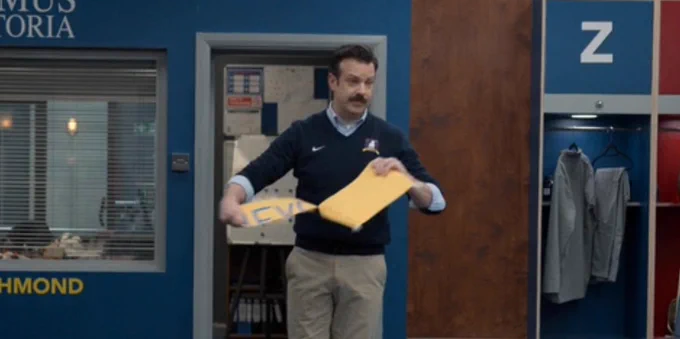 Ted Lasso ripping the believe sign.