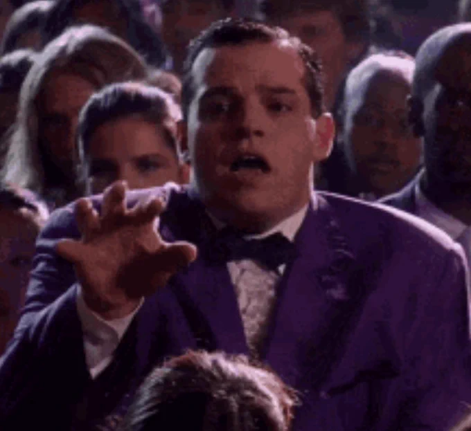Damian from Mean Girls gasping as Cady breaks the prom crown.