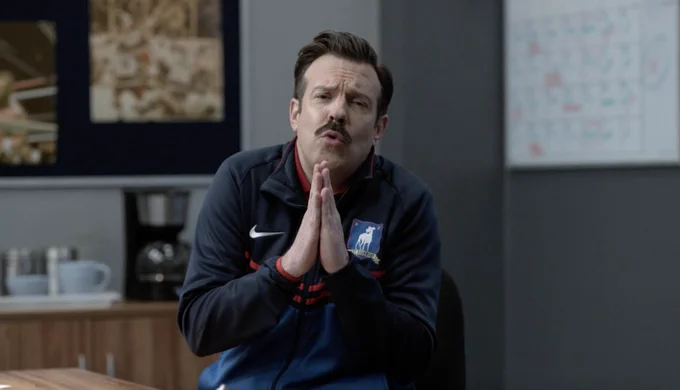 Ted putting his hands up like he's praying, facial expression pleading