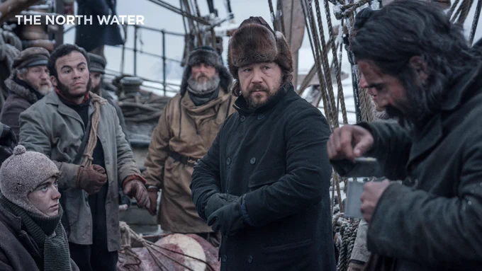 As Captain Brownlee in The North Water. He stares over at Colin Farrell's character, Henry Drax. They are surrounded by men on a ship.