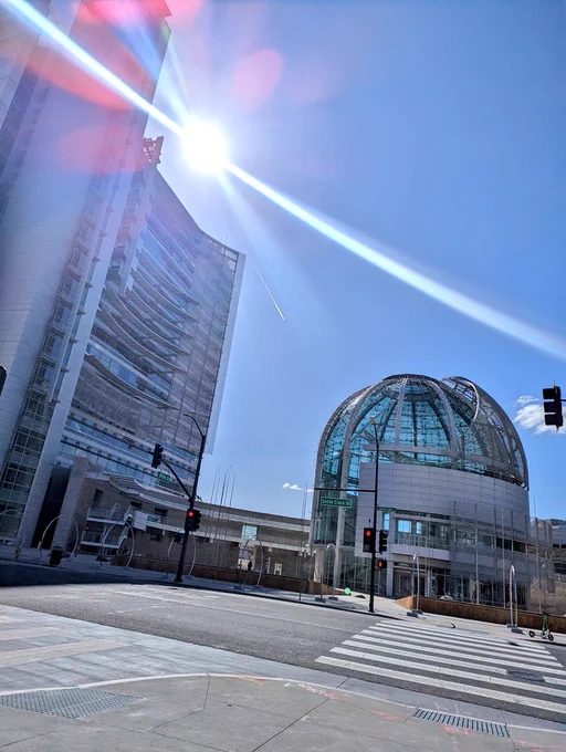 Photograph of San Jose City Hall with a blue sky. 
