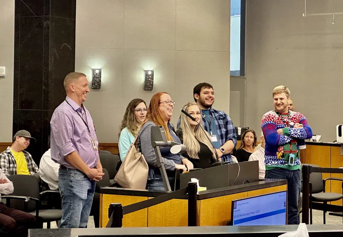 A group of people reading a proclamation