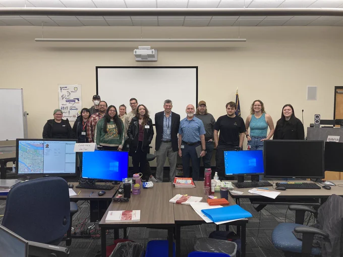 Commissioner Rene Gonzalez, Director Bob Cozzie, and a new class of 911 trainees