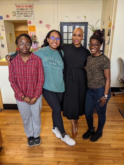 Rep. Ayanna Pressley poses for a photo with students at the Boston Latin Academy during her visit. 