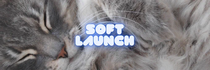 Soft launch banner with sleeping cat in the background and text saying "Soft Launch"