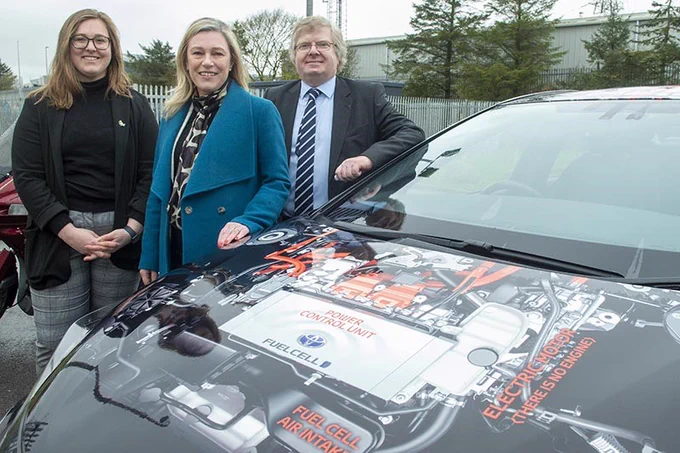 Aberdeen City Council Co-leader Councillor Ian Yuill and Net Zero, Environment and Climate Change co-convenor Councillor Miranda Radley with Minister for Energy Gillian Martin MSP beside a hydrogen-fuelled car.