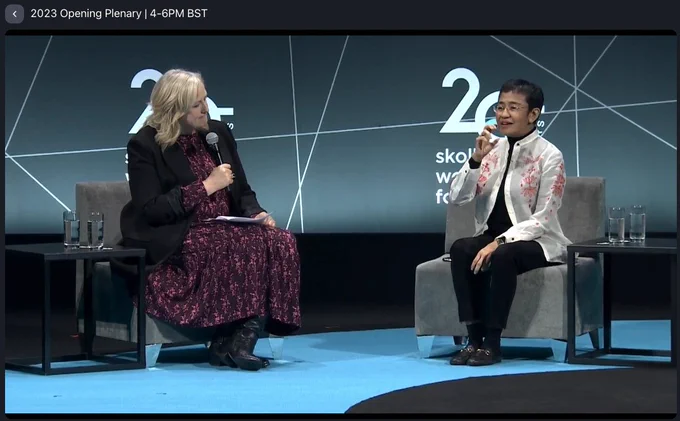 Maria Ressa with host at Skoll World Forum 2023
