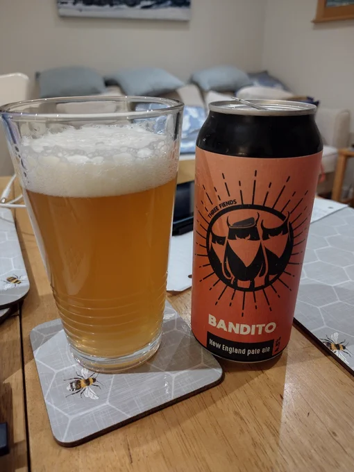 Pint of Three Fiends New England Pale next to its can.