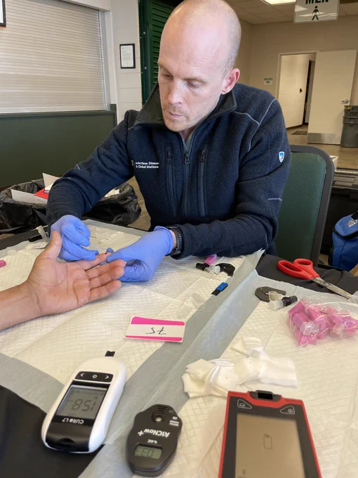 Dr. Beatty performing a Chagas disease rapid diagnostic test on a person.  